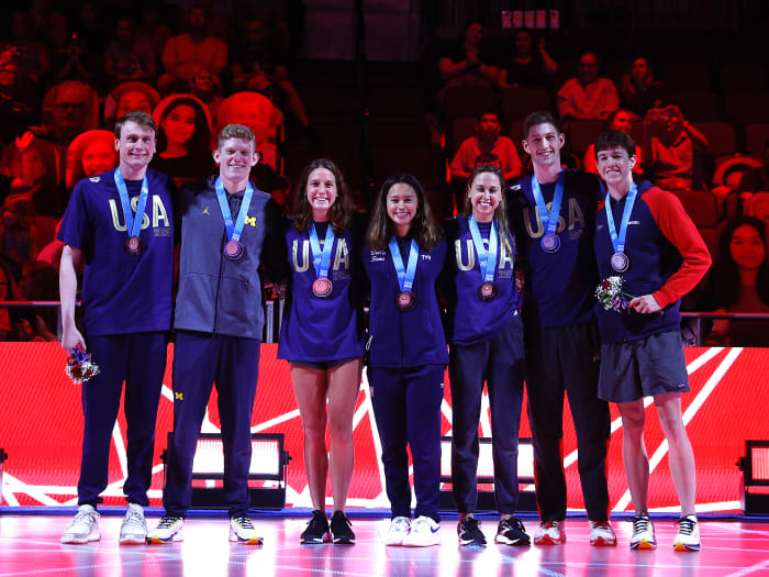 Brooke Forde (third from left) poses with teammates, from left: Bowe Becker, Patrick Callan, Bella Sims, Catie Deloof, Hunter Armstrong and Jake Mitchell during their medal ceremony during the 2021 U.S. Olympic Team Swimming Trials.